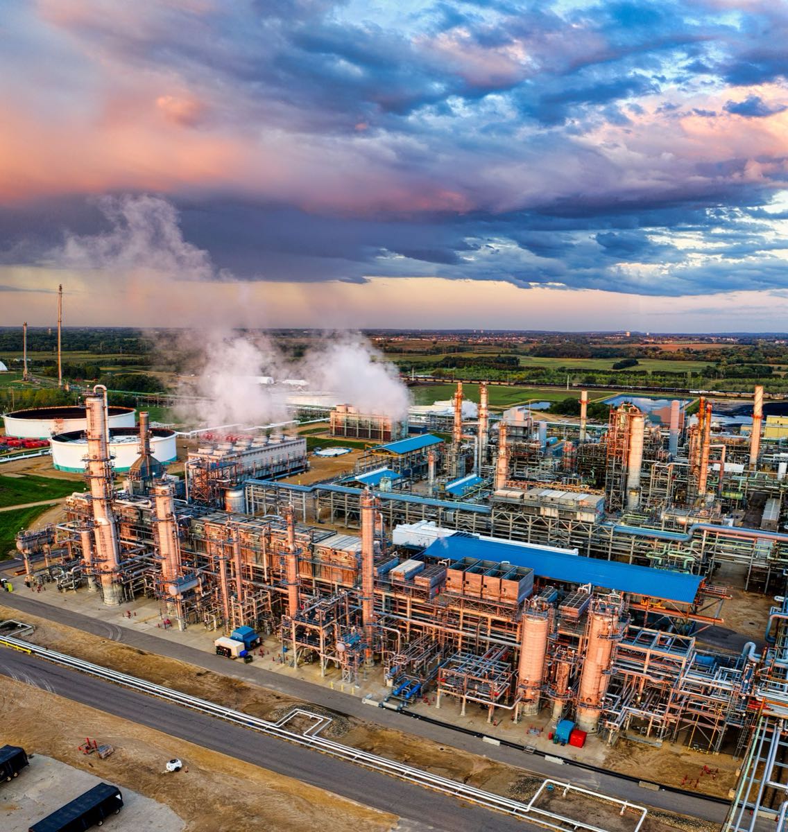 Aerial view of a refinery in golden-hour light
